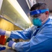 USNS Mercy Sailor Takes Test Sample in the Micro Laboratory