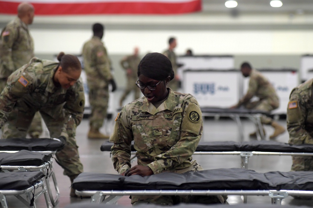 Maryland Army National Guard Guard members set up auxiliary medical station, prep for COVID-19 patients