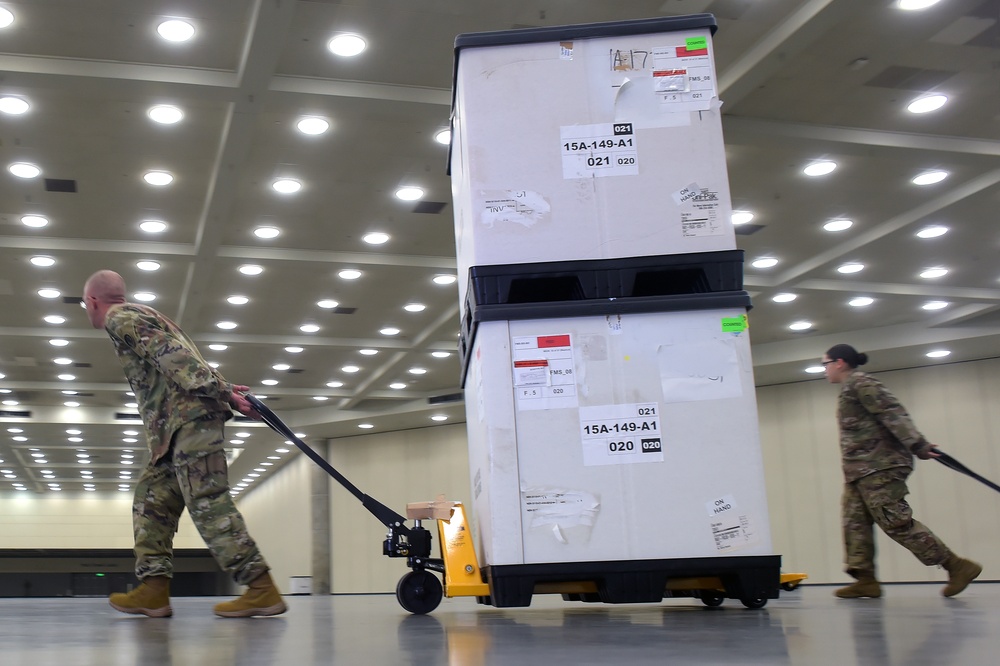 Maryland Army National Guard Guard members set up auxiliary medical station, prep for COVID-19 patients