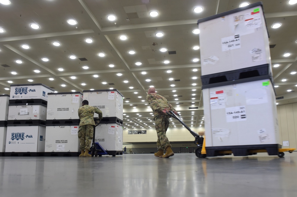 Maryland Army National Guard Guard members set up auxiliary medical station, prep for COVID-19 patients