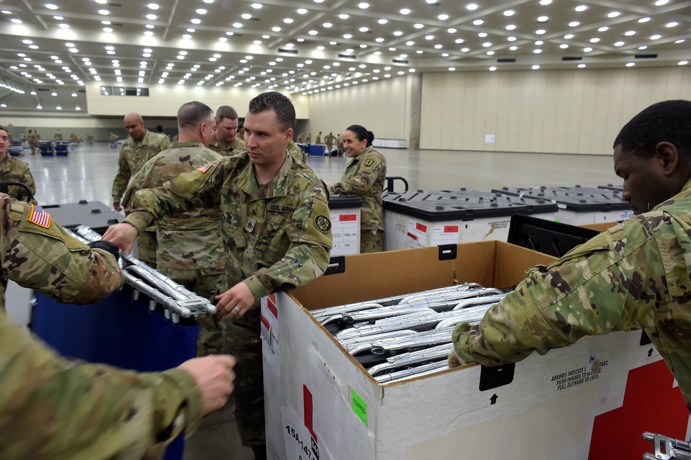 Maryland Army National Guard Guard members set up auxiliary medical station, prep for COVID-19 patients