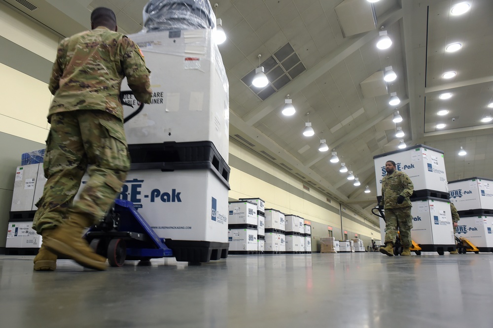 Maryland Army National Guard Guard members set up auxiliary medical station, prep for COVID-19 patients