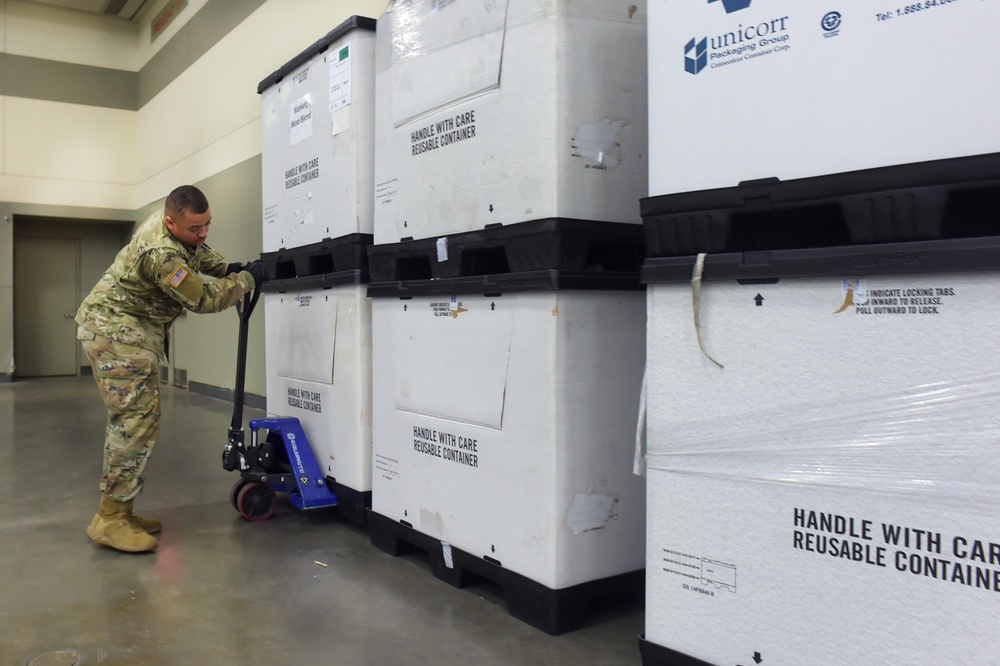 Maryland Army National Guard Guard members set up auxiliary medical station, prep for COVID-19 patients