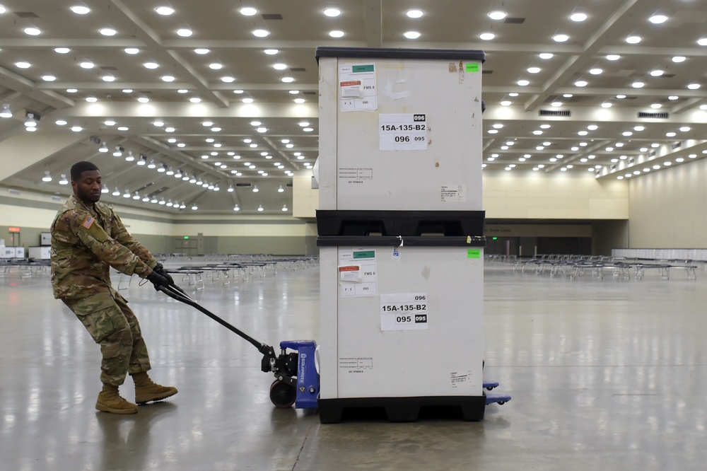 Maryland Army National Guard Guard members set up auxiliary medical station, prep for COVID-19 patients