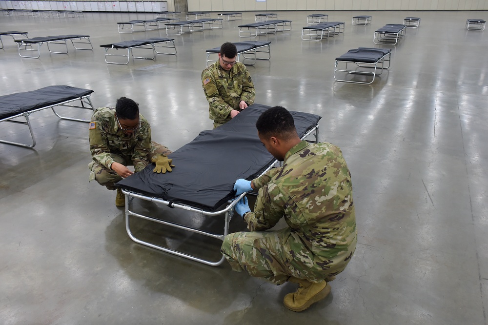 Guard members set up auxiliary medical station, prep for COVID-19 patients