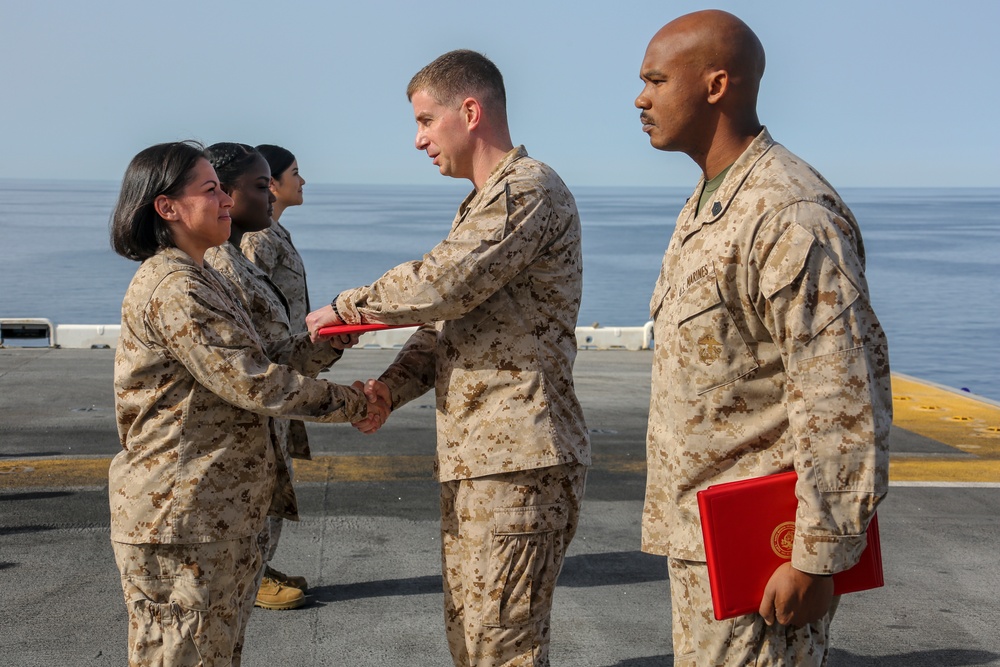 Corpsmen receive Fleet Marine Force pins aboard USS Bataan