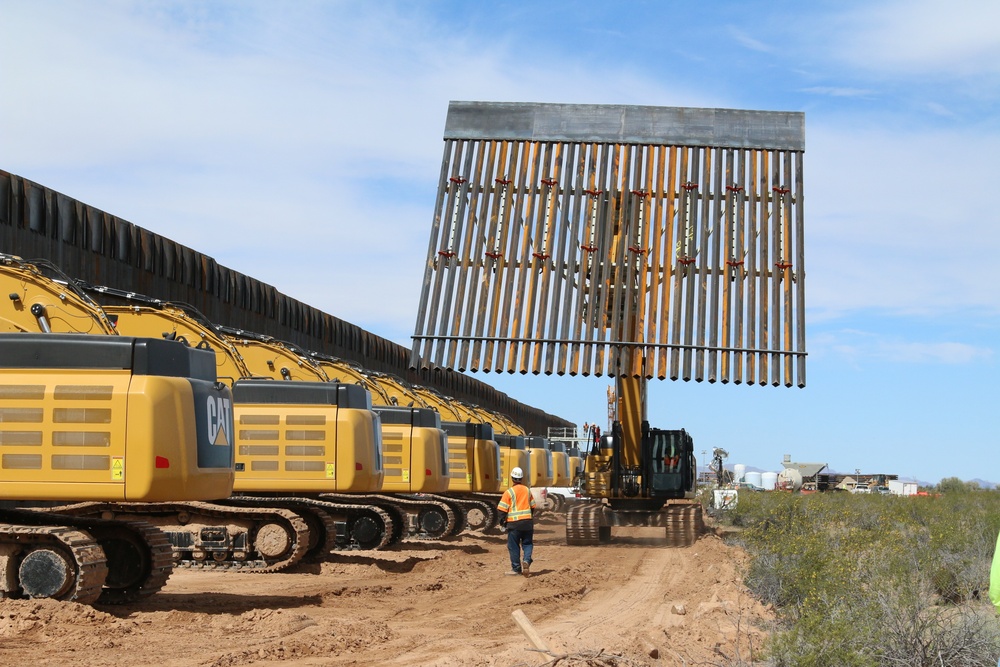 South Pacific Border District contractor using an excavator with a barrier rack attachment