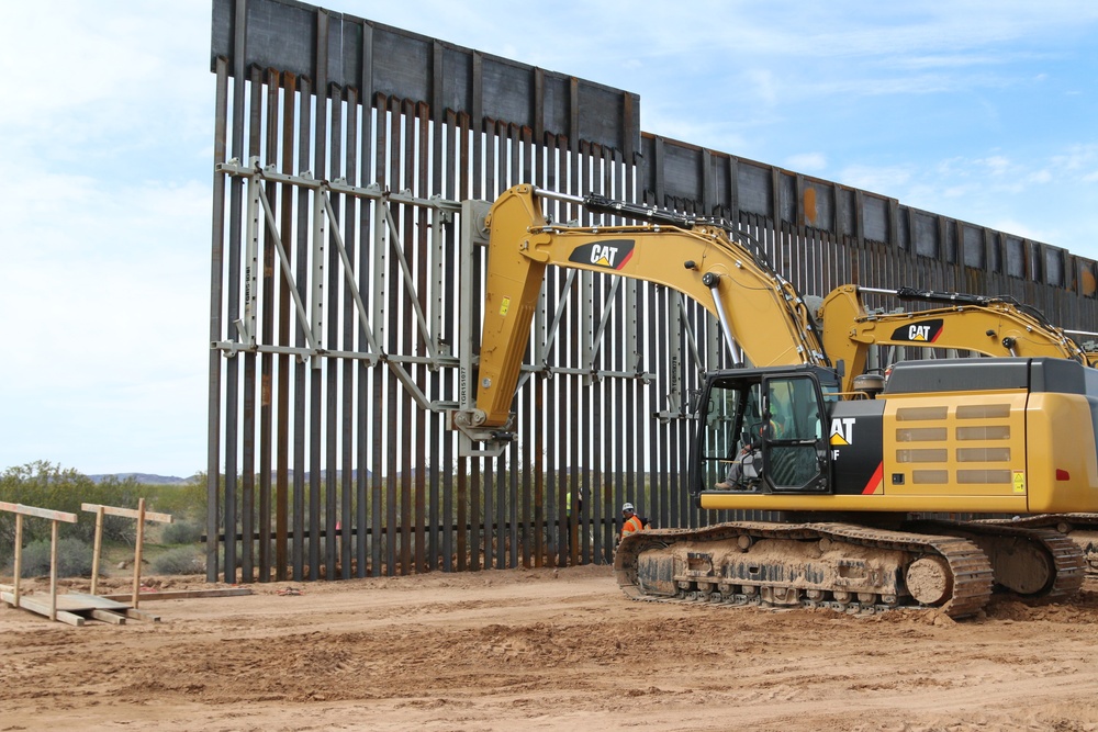 South Pacific Border District contractor using an excavator with a panel rack attachment