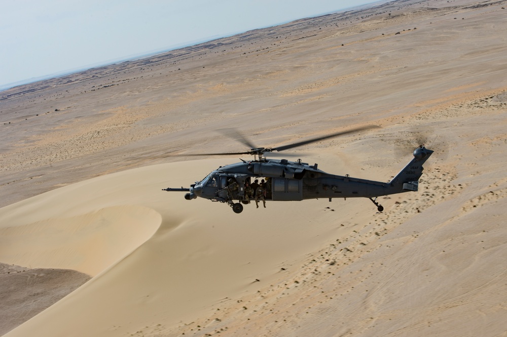 66th Expeditionary Rescue Squadron train in a HH-60G Pave Hawk over Qatar