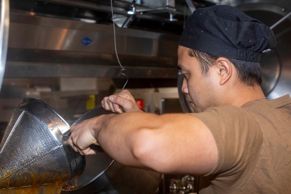 Sailor cook in the galley