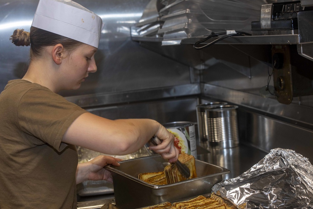 Sailor cook in the galley