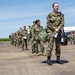 U.S. Navy Sailors wait to be screen on the flightline