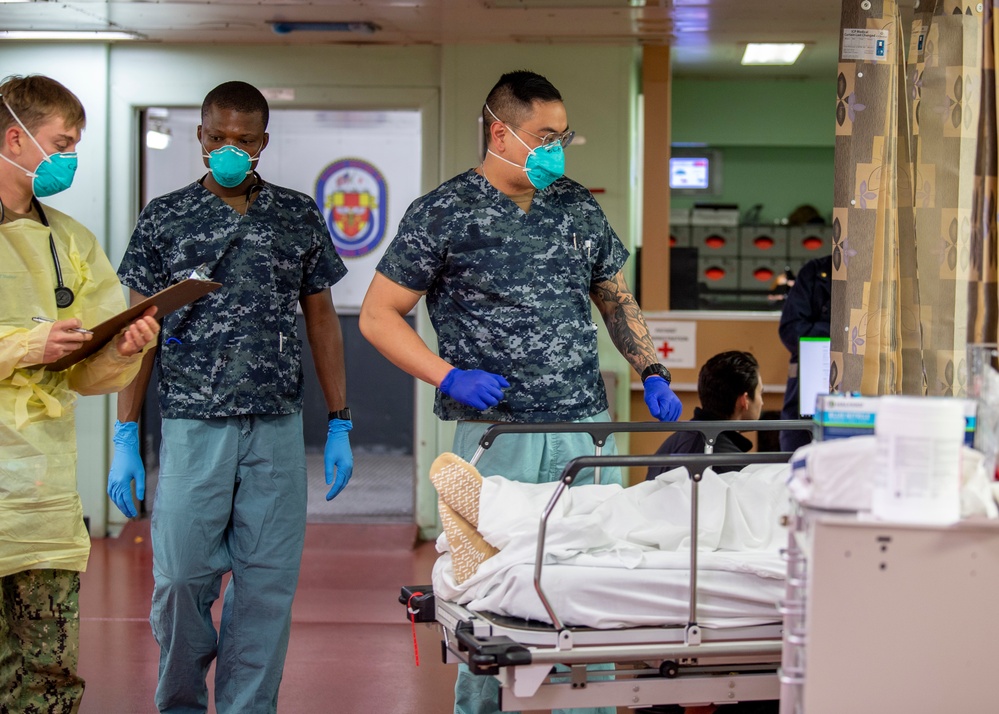 USNS Mercy Sailors Transport Patient