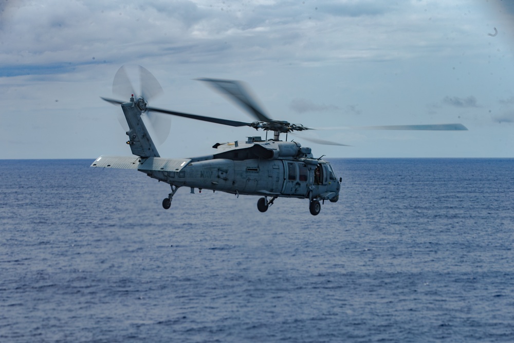 Marines with 31st MEU and Sailors with the USS America conduct flight operations on the America