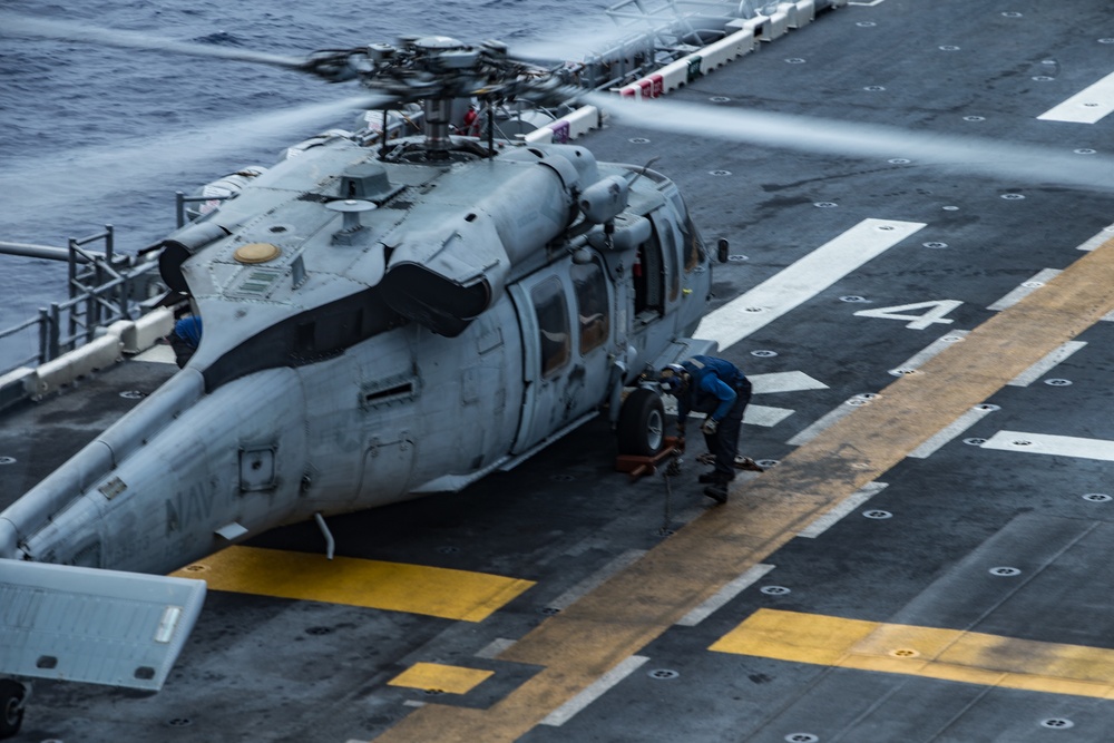 Marines with 31st MEU and Sailors with the USS America conduct flight operations on the America