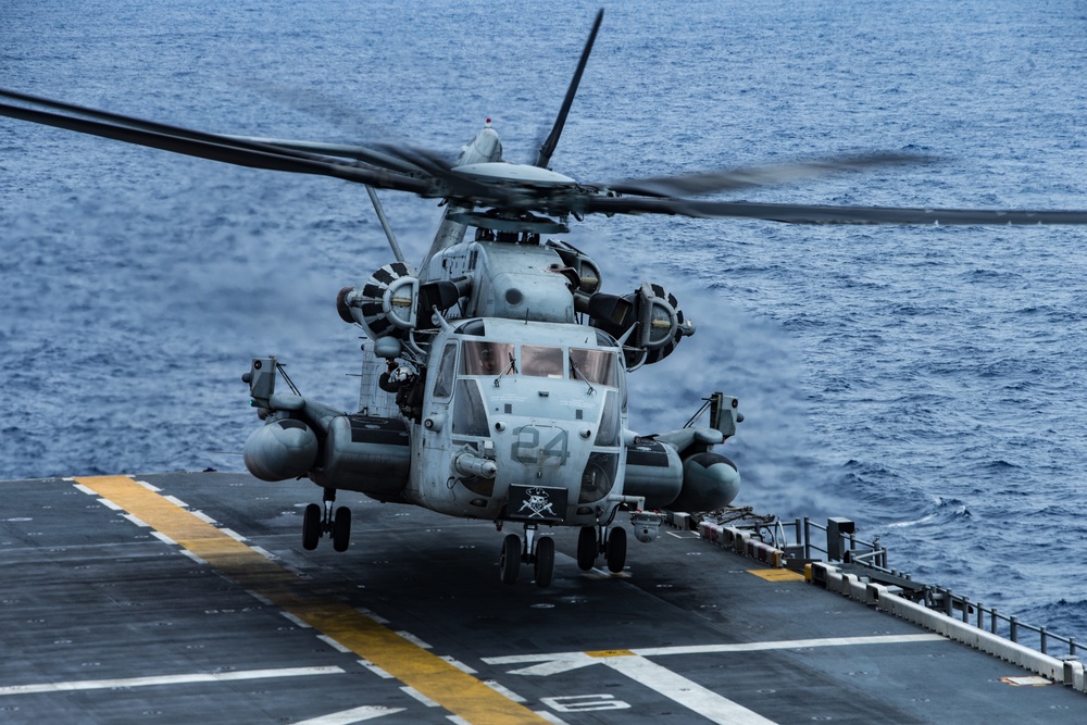 Marines with 31st MEU and Sailors with the USS America conduct flight operations on the America