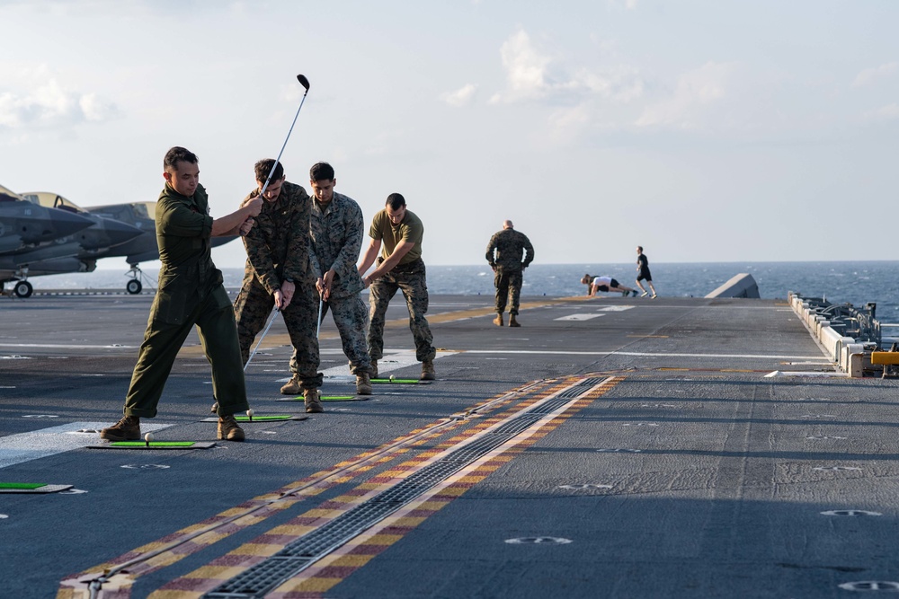USS America Sailors, 31st MEU Marines Play Golf on Flight Deck