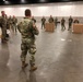 MAJ Robert Mathews, Commander of the 507th EN BN,  briefs members of the 1433 EN CO. on operations at the TCF Center for development of an alternate care facility for the state of Michigan. On 01 April 2020