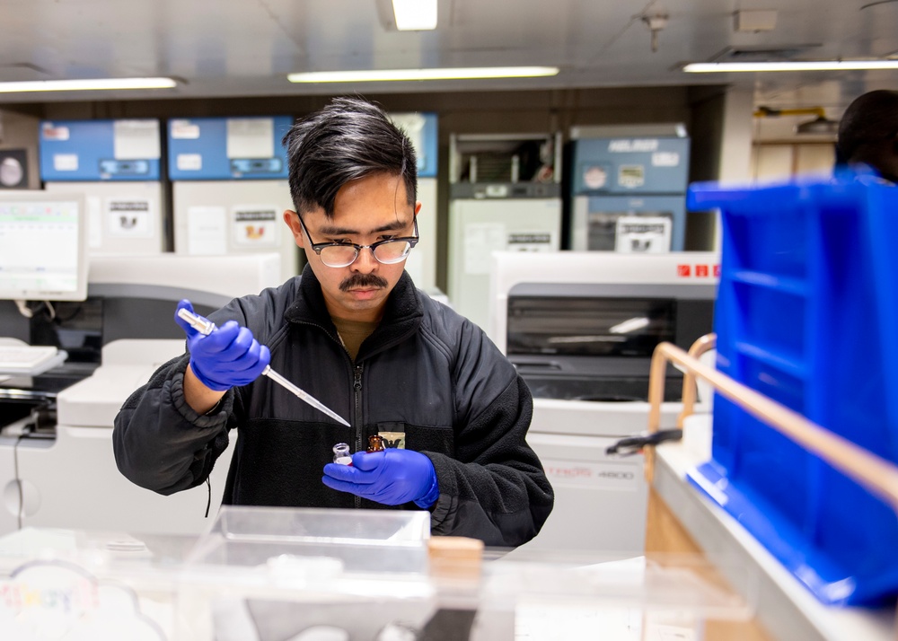 USNS Mercy Sailor Works in Laboratory