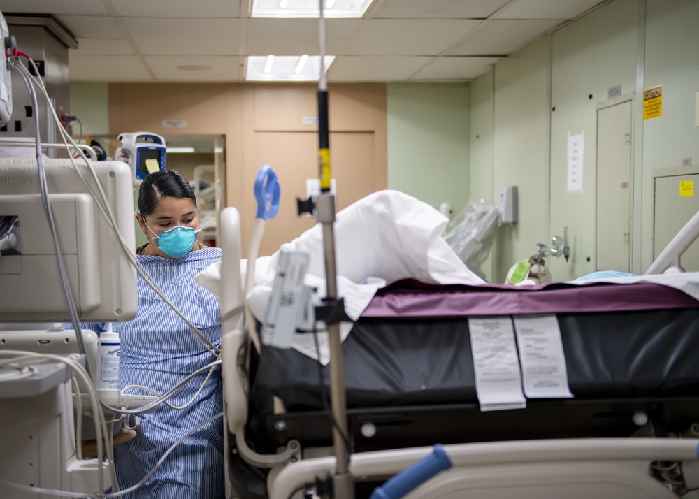 USNS Mercy Sailor Treats Patient