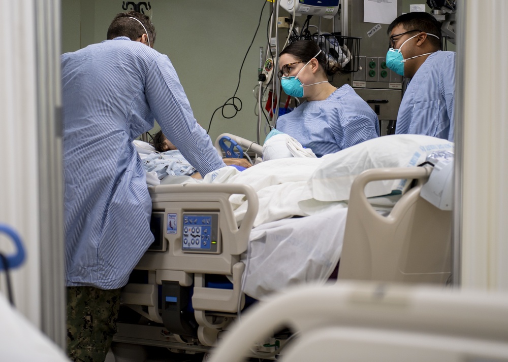 USNS Mercy Sailors Treat Patient