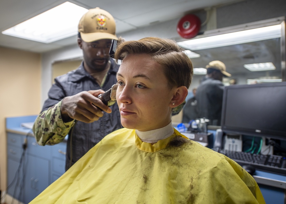 USNS Mercy Sailor Receives Haircut
