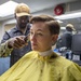 USNS Mercy Sailor Receives Haircut