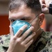 USNS Sailors Dons a Mask
