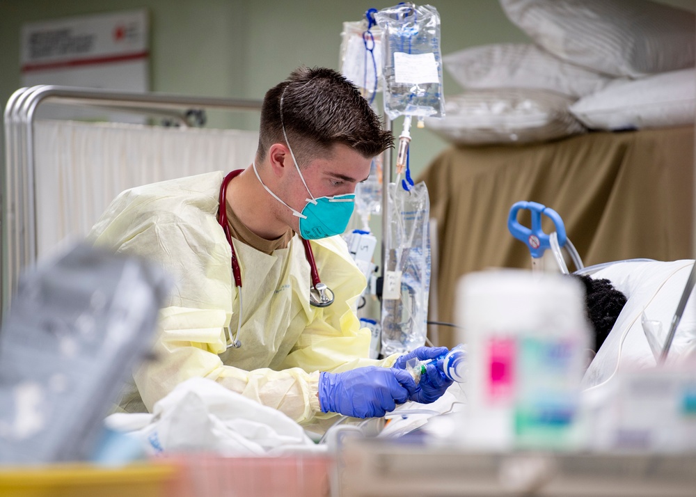 USNS Mercy Sailor Treats Patient