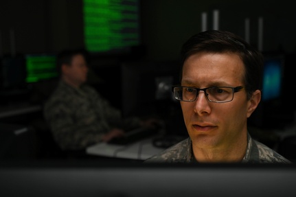 U.S. Air Force Maj. Robert Duluca, Maryland National Guard Joint Task Force Cyber operations officer, poses for a photo April 3, 2020, at the 175th Wing at Warfield Air National Guard Base, Middle River, Md.
