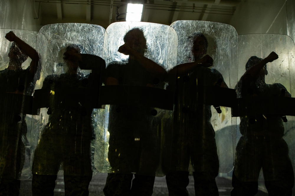 31st MEU Marines practice riot control techniques aboard USS America