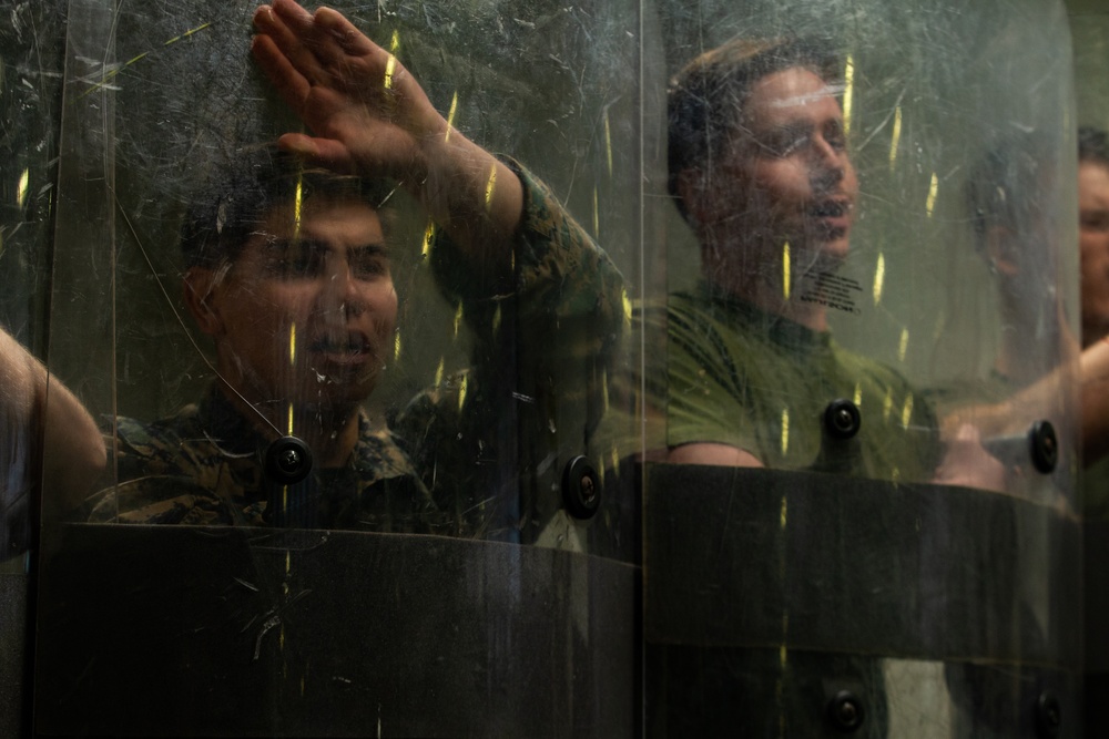 31st MEU Marines practice riot control techniques aboard USS America