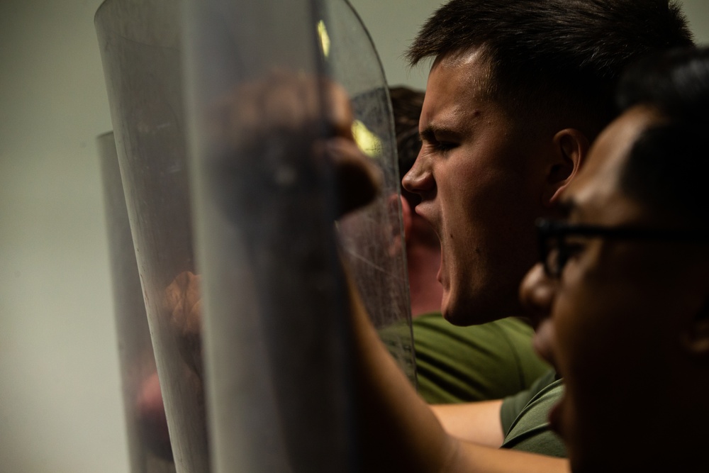 31st MEU Marines practice riot control techniques aboard USS America