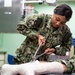 USNS Mercy Sailor Removes a Cast During Training