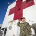 USNS Mercy Sailor Render a Hand Salute