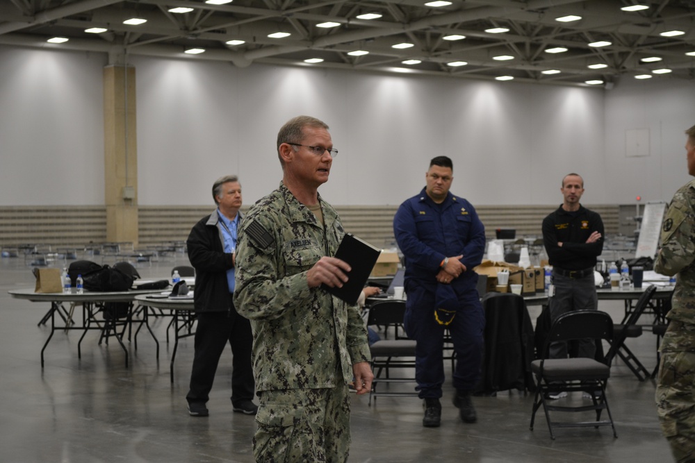 EMF Sailors Briefs FEMA and DHHS Officials During a Rehearsal of Concept for Patient Care