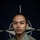 NATO BG-P EIB and ESB awardees A U.S. Army soldier poses for an official portrait against a NATO flag backdrop. The soldier is wearing MultiCam (OCP) camouflage uniform with visible insignia and patches. The image appears to be an official NATO Enhanced Forward Presence (eFP) Battle Group promotional portrait.