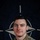 NATO BG-P EIB and ESB awardees A U.S. Army soldier named Jamieson poses for an official NATO Enhanced Forward Presence (eFP) Battle Group portrait against a NATO flag backdrop. The soldier wears MultiCam (OCP) camouflage uniform with visible unit patches and a name tape. The image is part of a #WeAreNATO social media campaign.