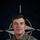 NATO BG-P EIB and ESB awardees A U.S. Army soldier named Keane is photographed in a formal portrait setting against a NATO flag backdrop. The soldier is wearing MultiCam (OCP) camouflage uniform with visible name tape, branch tape, and unit patches. This appears to be an official NATO Enhanced Forward Presence (eFP) Battle Group promotional image.