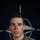 NATO BG-P EIB and ESB awardees A U.S. Army soldier poses for an official portrait in front of a NATO flag backdrop. The image is part of a NATO Enhanced Forward Presence (eFP) Battle Group public affairs campaign. The soldier wears MultiCam (OCP) camouflage uniform with visible rank and branch insignia.
