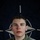 NATO BG-P Soldiers test on EIB and ESB tasks A young U.S. Army soldier is photographed in front of a NATO flag backdrop. The image appears to be an official NATO Enhanced Forward Presence (eFP) Battle Group promotional portrait. Overlaid text and insignia indicate this is part of a NATO social media or public affairs campaign.