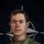 NATO BG-P Soldiers test on EIB and ESB tasks A U.S. Army soldier poses for an official portrait against a NATO flag backdrop. The soldier is wearing MultiCam (OCP) camouflage uniform with visible name tape reading 'THOMAS' and a U.S. Army tape, along with what appears to be an Infantry or Combat badge. The image is part of a NATO eFP (enhanced Forward Presence) Battle Group Poland promotional campaign.