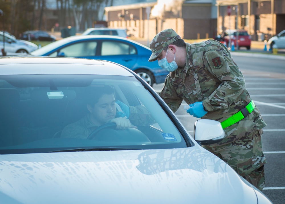 Connecticut Guardsmen screen personnel entering Bradley Air National Guard Base