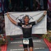 Lt. Duane Zitta crosses Kona Ironman finish line