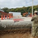 U.S. Navy Seabees with NMCB-5’s Detail Sasebo work on two pre-engineered buildings for NBU-7