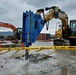 U.S. Navy Seabees with NMCB-5’s Detail Sasebo work on two pre-engineered buildings for NBU-7