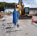 U.S. Navy Seabees with NMCB-5’s Detail Sasebo work on two pre-engineered buildings for NBU-7