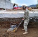 U.S. Navy Seabees with NMCB-5’s Detail Sasebo work on two pre-engineered buildings for NBU-7