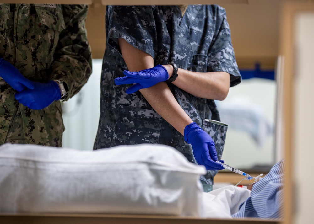 USNS Mercy Sailors Administer Medicine