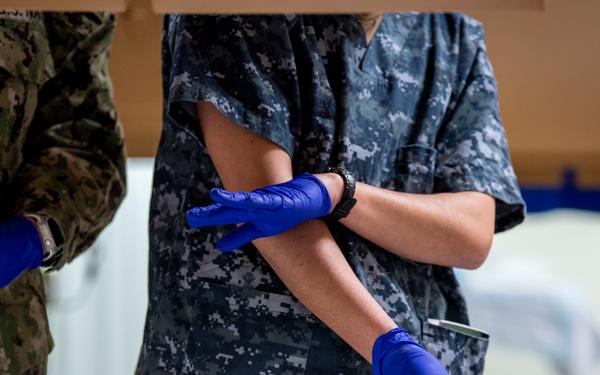 USNS Mercy Sailors Administer Medicine
